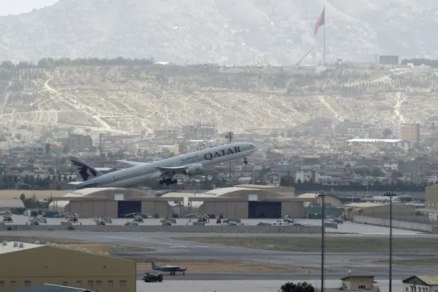 A Qatar Airlines flight leaves Kabul airport.