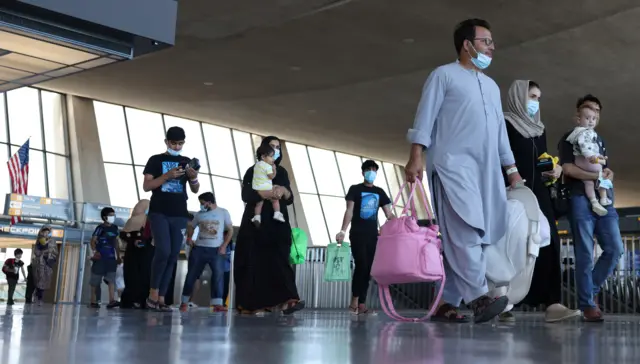 Afghan refugees arriving at Dulles airport.