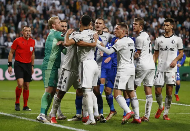 Leicester and Legia players square up