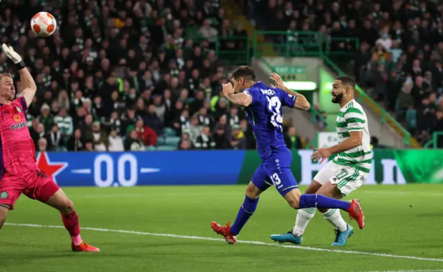 Lucas Alario heads into Celtic's net