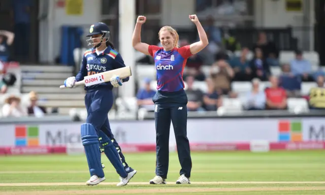 Freya Davies celebrates taking a wicket