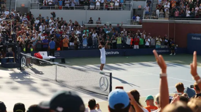 Dan Evans celebrates his victory