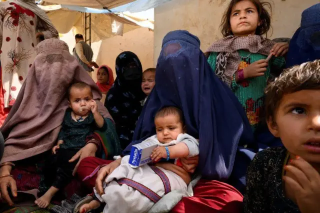 Women and children at a mobile clinic in Lashkar Gah in March 2021