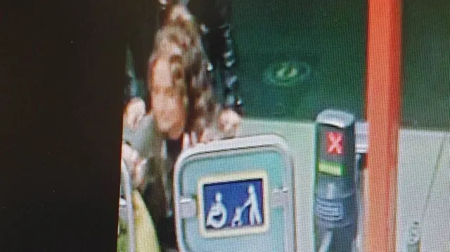 Woman at station in CCTV image