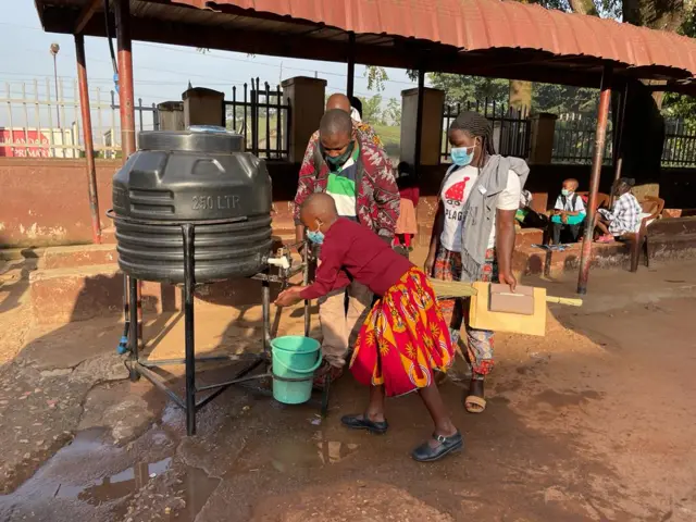 A pupil washes hands