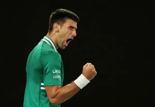 Serbia's Novak Djokovic celebrates winning the third set during his quarter final match against Germany's Alexander Zverev at the Australian Open in Melbourne Park, Melbourne, Australia, 16 February 2021