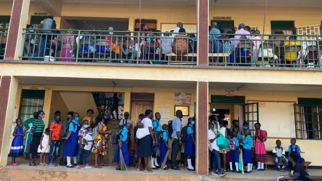 Pupils queue in a school