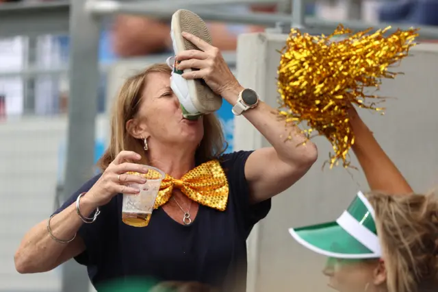 Fan drinks from shoe