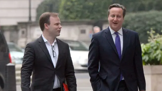 Sir Craig Oliver walking with David Cameron