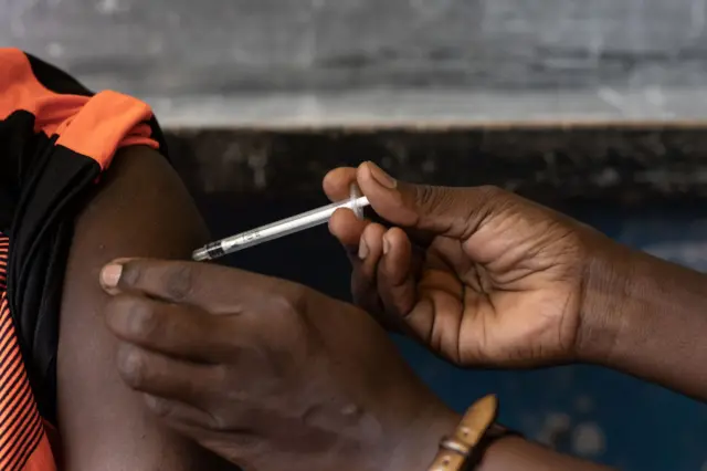 Someone getting vaccinated in Uganda