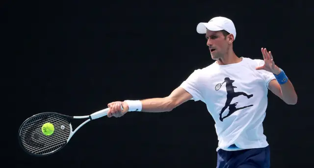 Novak Djokovic of Serbia practices on Rod Laver Arena ahead of the 2022 Australian Open at Melbourne Park on January 11, 2022 in Melbourne, Australia.