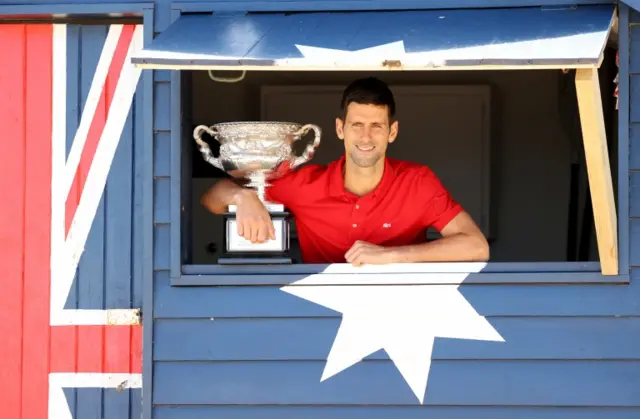 Novak Djokovic pictured with his Australian trophy in 2021