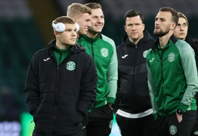 Chris Mueller with his new Hibs team-mates at Celtic Park