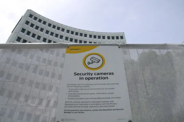 Security camera sign outside a MIQ (managed isolation quarantine) hotel in Christchurch