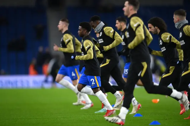 Tariq Lamptey and Brighton players warm up