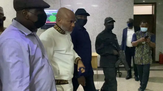 Nigeria State Secret Police (SSS) escorts Indigenous People of Biafra (IPOB), Nnamdi Kanu (2nd L), outside the Federal High Court during the trial of the IPOB leader