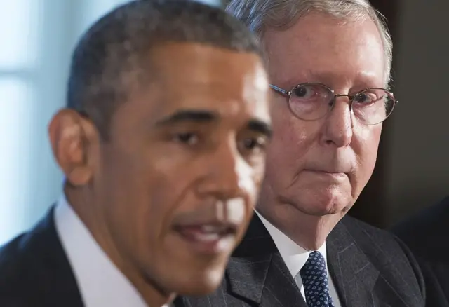 US President Barack Obama speaks alongside Senate Majority Leader Mitch McConnell