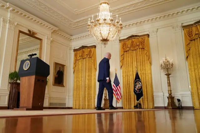 Biden walking out of east room