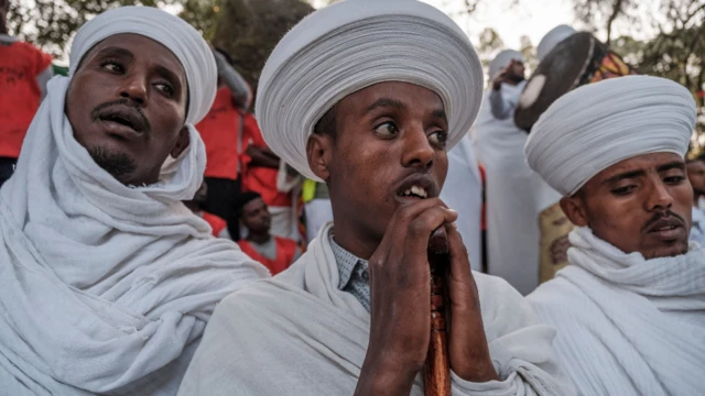 Ethiopian Orthodox worshippers at the compound of Fasilides Bath during the celebration of Timket, the Ethiopian Epiphany, in the city of Gondar, Ethiopia – 19 January 2022