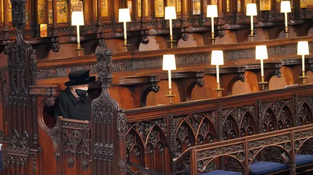 The Queen sitting alone at her husband's funeral