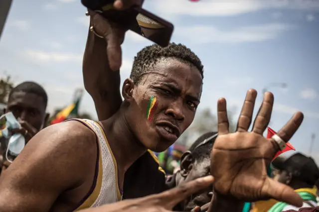 A Malian protester during a mass demonstration against sanctions imposed on Mali and