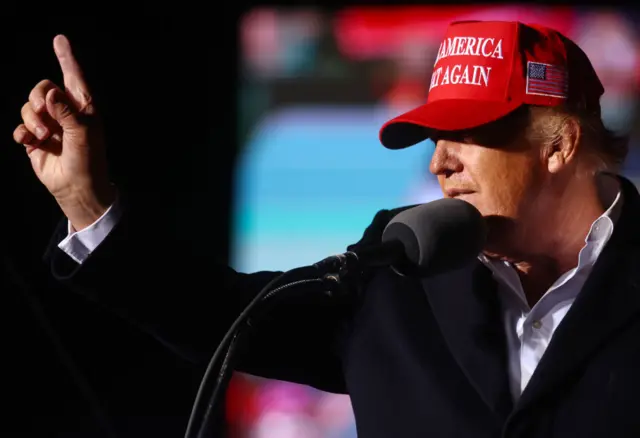 Former President Donald Trump speaks at a rally at the Canyon Moon Ranch festival grounds on January 15, 2022