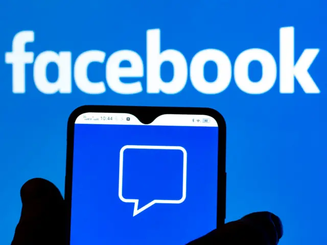 In this photo illustration, the Comments by Facebook logo is seen displayed on a smartphone screen with the Facebook logo in the background