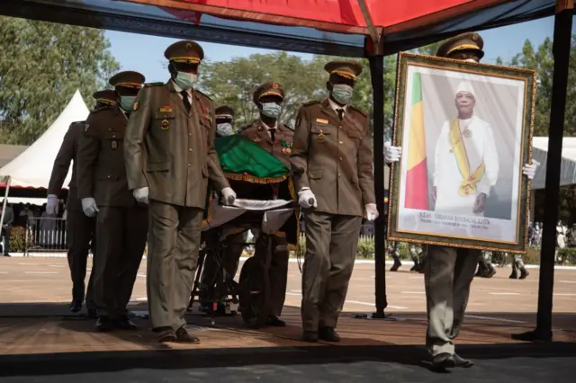 Malian Military guards wheel in the coffin of the late ousted President of Mali, Ibrahim Boubacar Keita during his funeral ceremony in Bamako on Friday.