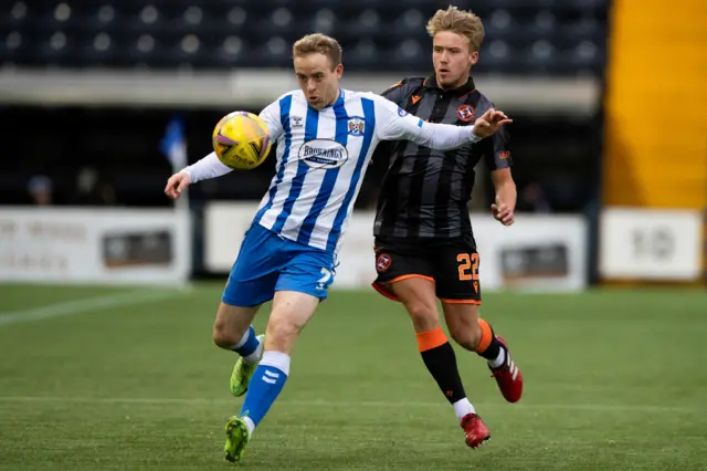 Kilmarnock's Rory McKenzie holds off Dundee Utd's Kieran Freeman