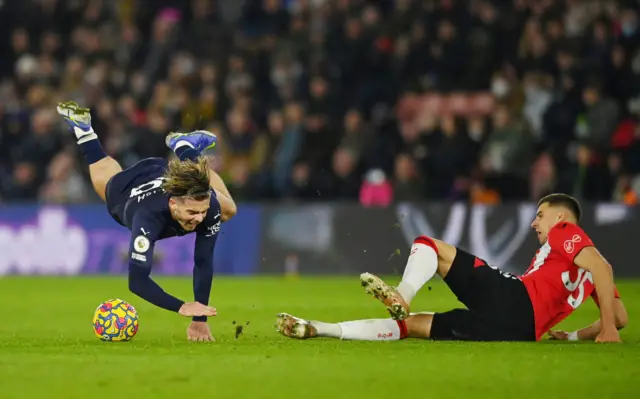 Jan Bednarek fouls Jack Grealish