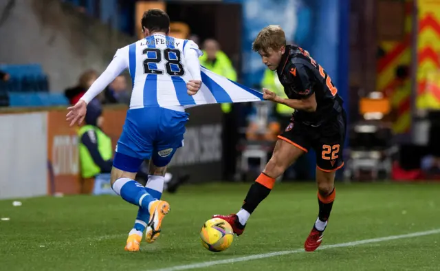 Dundee United's Kieran Freeman pulls Kilmarnock's Kyle Lafferty's shirt