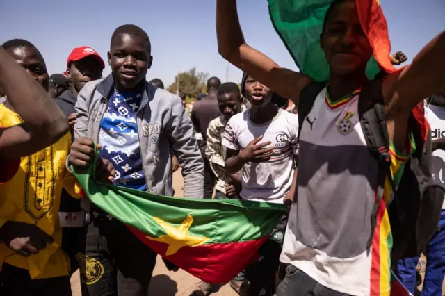 A group of people celebrate in Ouagadougou