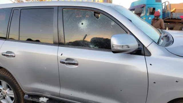 Bullet holes are seen in a car that belong to presidency following heavy gunfire near the President Roch Kaboré's residence in Ouagadougou, Burkina Faso, on 24 January.