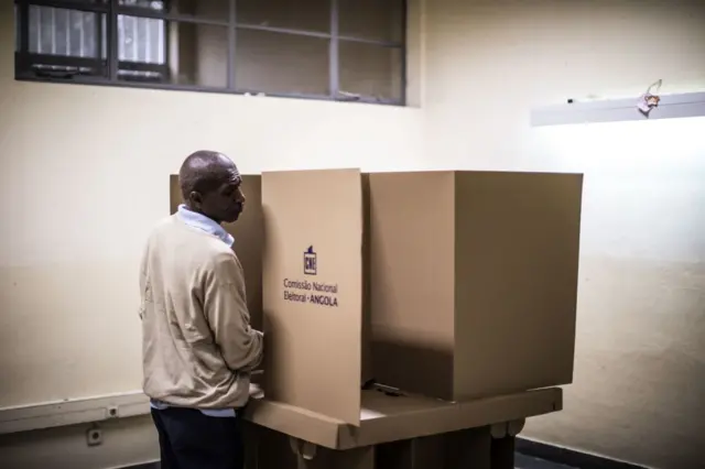 An Angolan voter marks his ballot at a polling station in Luanda, in August 2017.