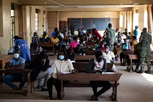 Patients queue prior to being vaccinated on September 29, 2021 in Kampala, Uganda.