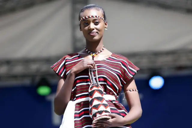 A female model presents a traditional dress during the 13th Addis Ababa Cultural Festival at Gihon Park in Addis Ababa, Ethiopia on January 25, 2022.