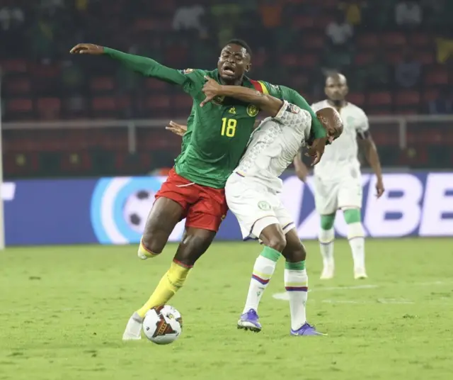 Martin Hongla (L) of Cameroon in action against Fouad Bachirou (R) of Comoros during 2021 Africa Cup of Nations last 16 soccer match between Cameroon and Comoros at Paul Biya Stadium in Yaounde, Cameroon on January 24, 2022