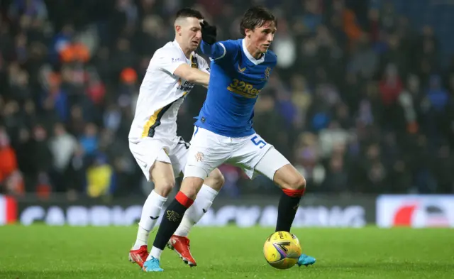 Rangers' Alex Lowry (right) holds off Livingston's Jason Holt