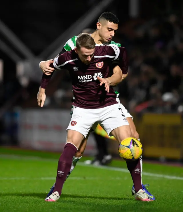 Hearts' Stephen Kingsley (left) and Celtic's Giorgos Giakoumakis