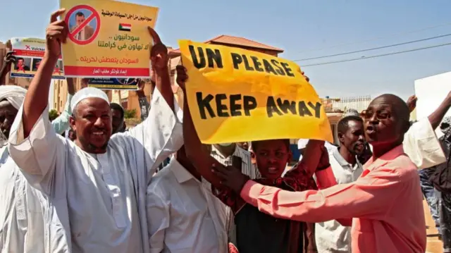 Pro-military demonstrators hold up banners in Khartoum, Sudan - Wednesday 26 January 2022