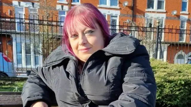 Jenny Smith sitting on a park bench