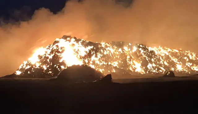 Hay bales on fire