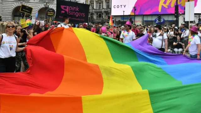 Giant rainbow flag at London Pride event