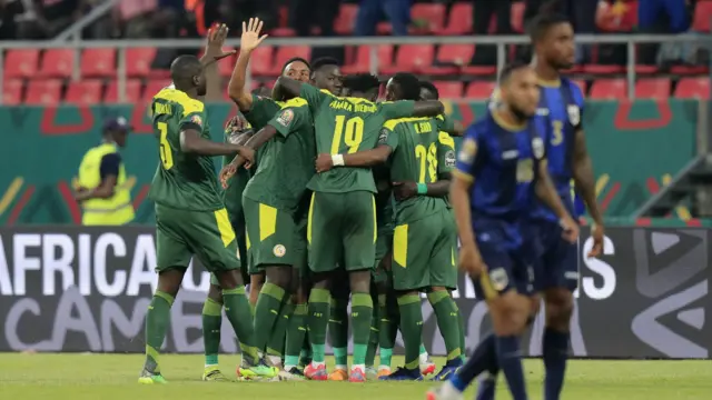 Senegal celebrate scoring against Cape Verde