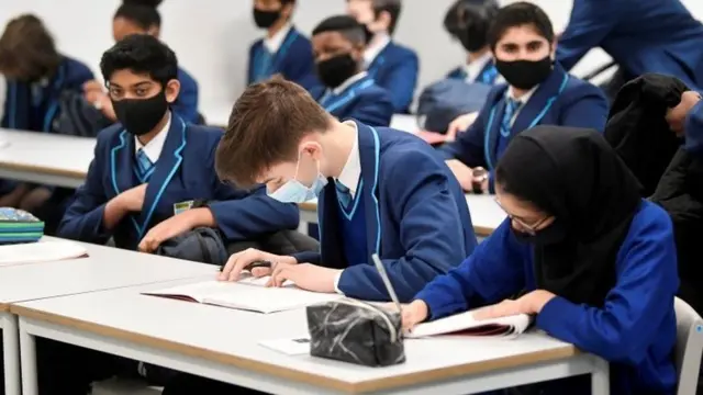 Kids in masks in a school