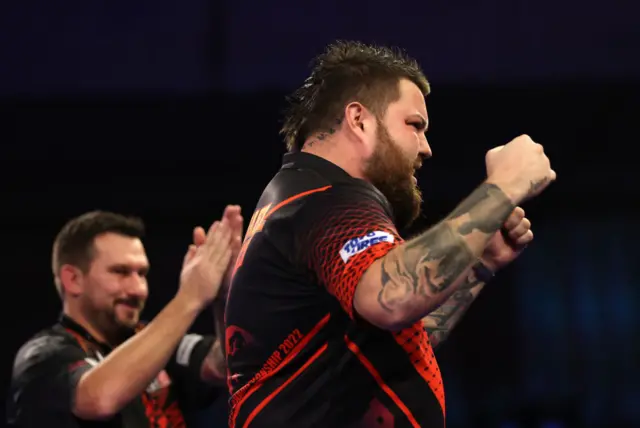 Michael Smith beats Jonny Clayton.