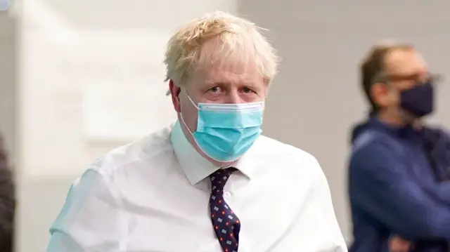 Boris Johnson in a mask