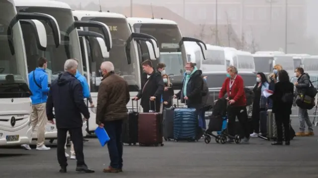 AIDAnova cruise passengers leave Lisbon's port due to an outbreak of the coronavirus among the cruise's crew in Lisbon