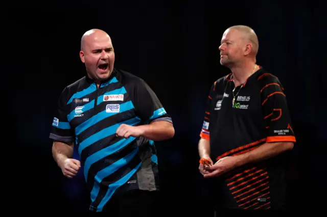 Rob Cross and Raymond van Barneveld.