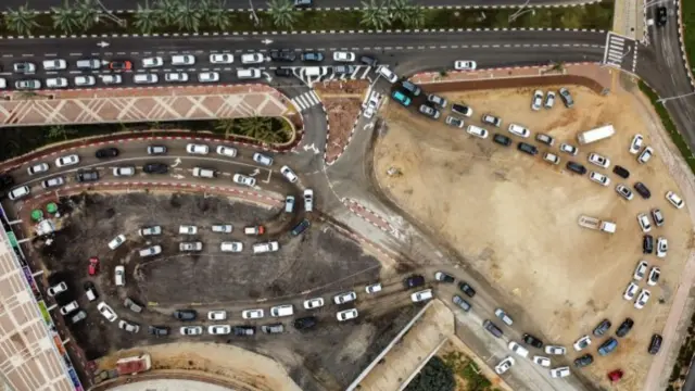 Drone photograph showing people queuing in their cars for Covid-19 tests in Ashdod, southern Israel (3 January 2022)